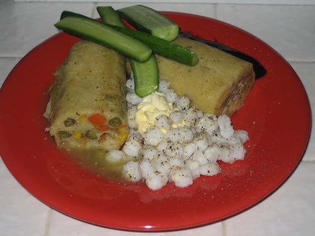 Tamales with sauce, hominy and cukes
