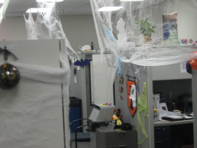lights, ghosts, spider webs and other decor on grey cubicals
