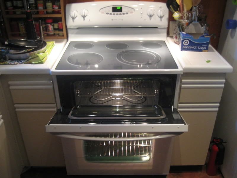 white stove with upper oven door open