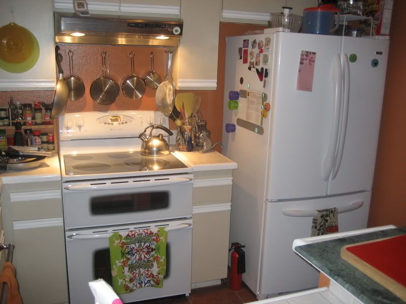 white stove in place with fridge
