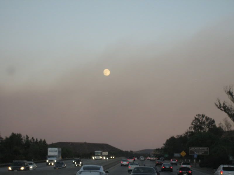 smoke on the commute home with full moon and mountains