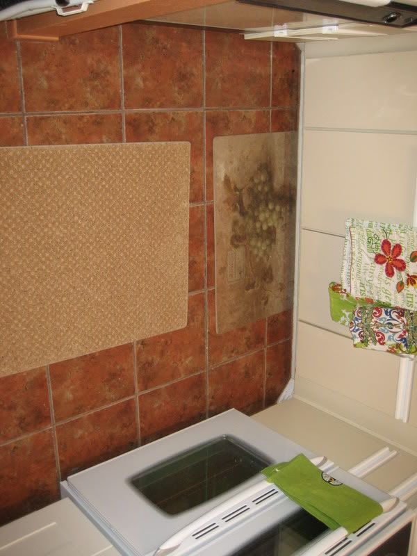 beige kitchen cabinets with floor tile and carpets