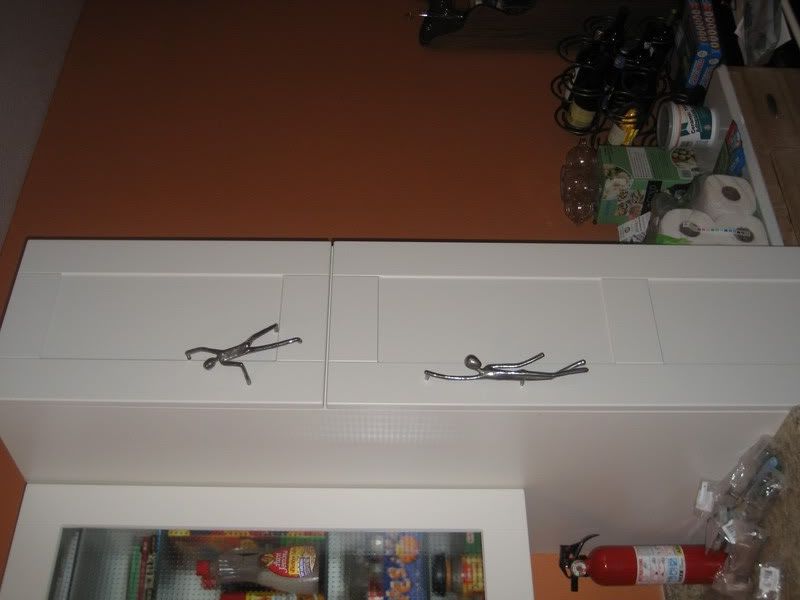 pantry doors closed, upper climbing stickman, lower dangling stickman