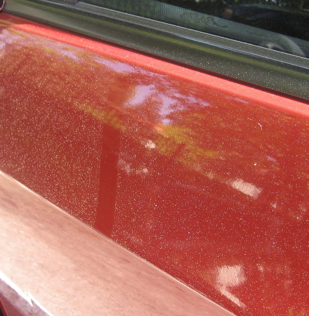 excessive yellowish pollen on formerly clean red car