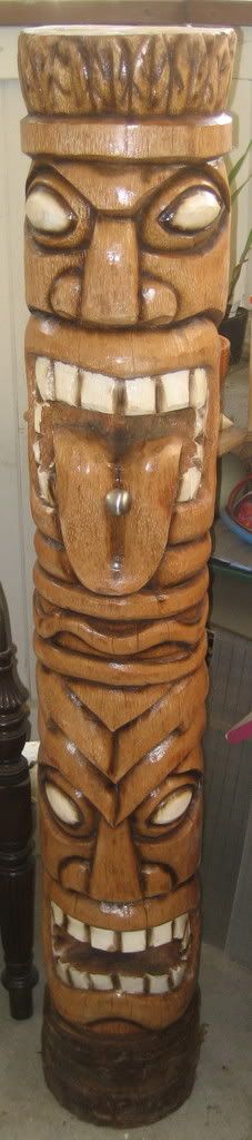 2 headed Tiki totem with tongue piercing