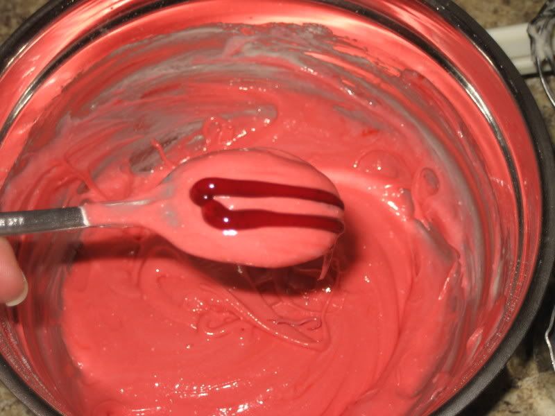 Rainbow Cake Color, two stripes of red on a spoon