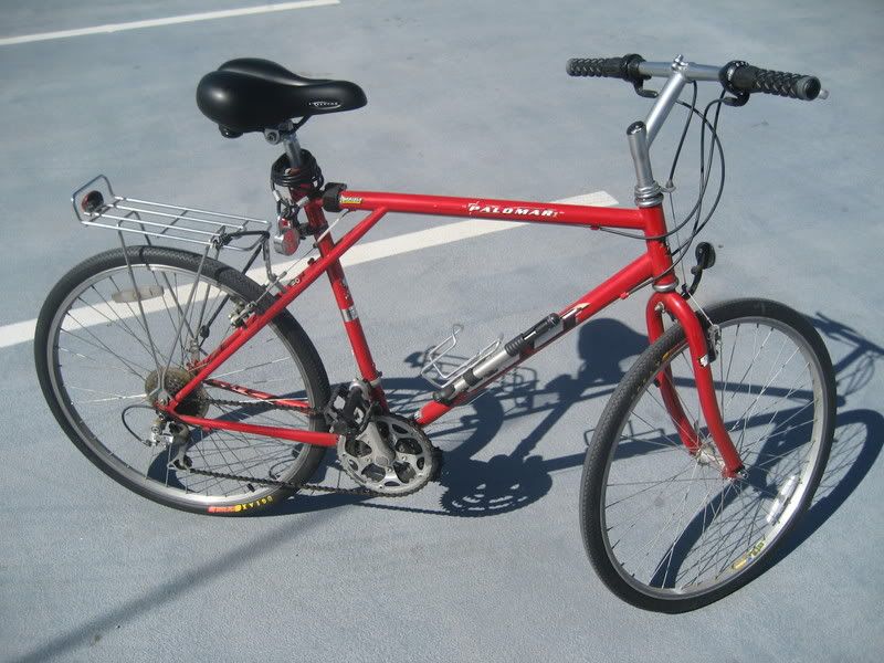 red bike with little smooth tires and gel seat