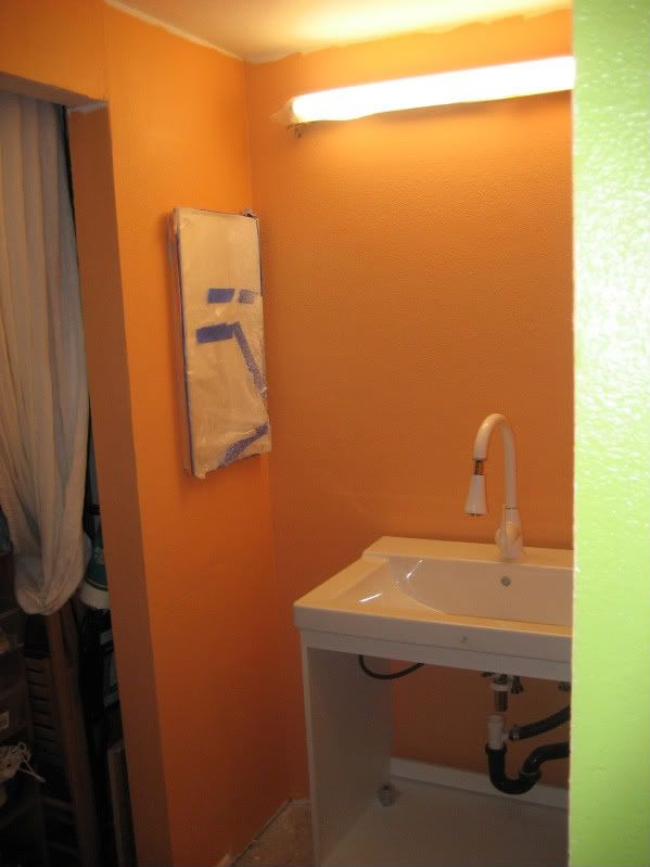 vanity reno orange wall with freestanding vanity