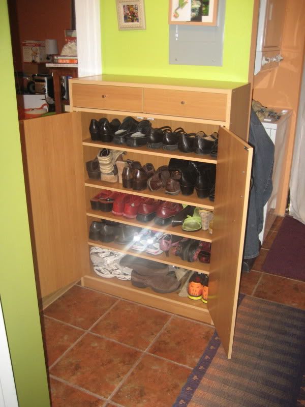 new shoe cabinet with open doors, showing it full of shoes