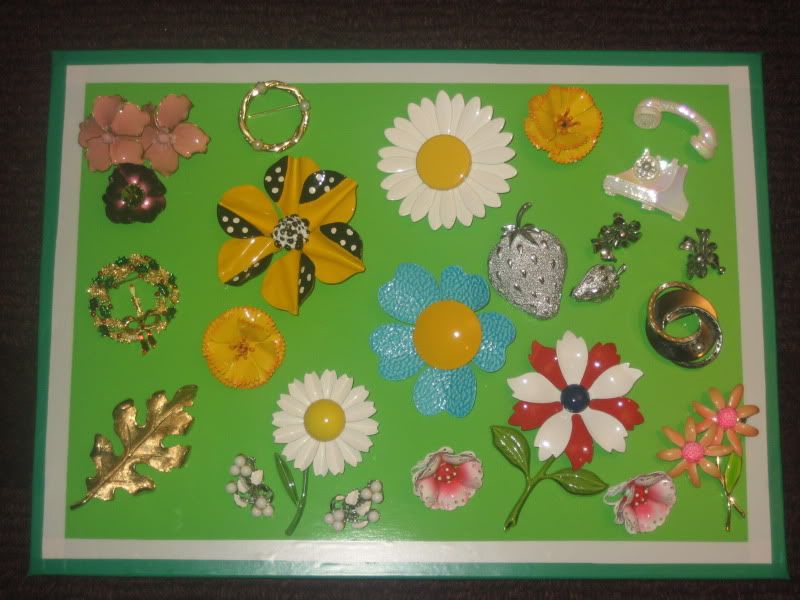 flower pins on green foamcore