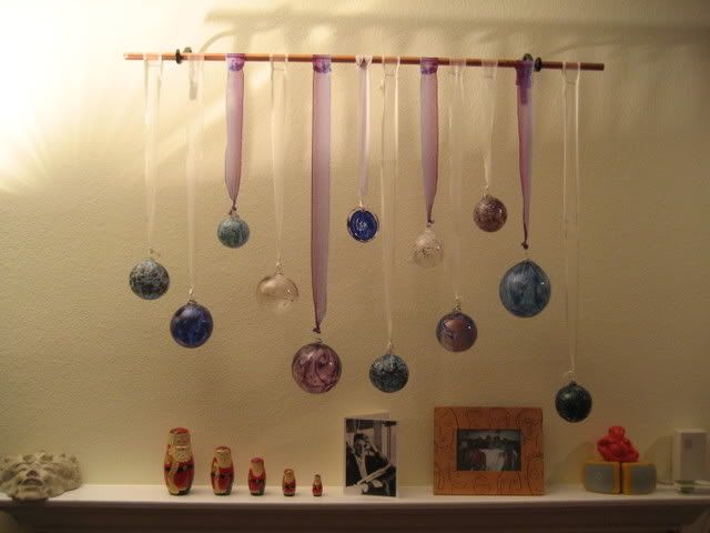 glass ornaments hanging over mantle