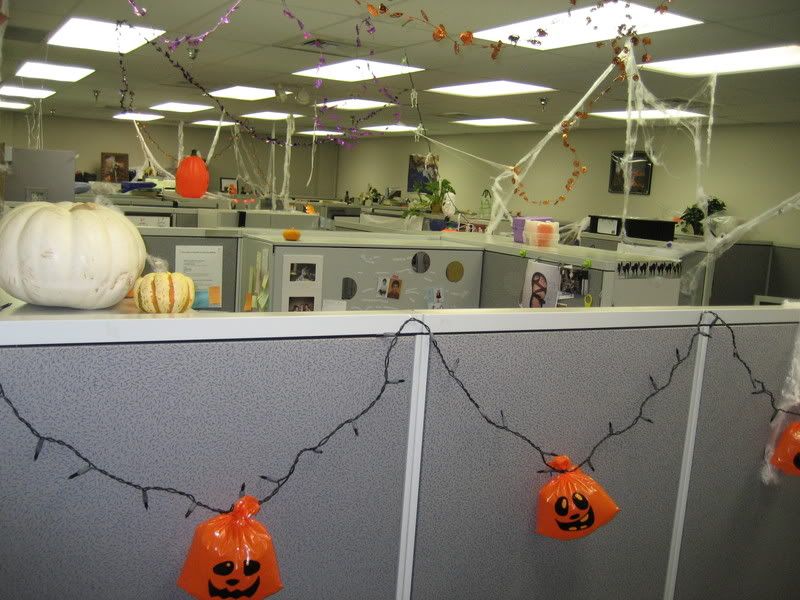 office decor including plastic pumpkins lights and cobwebs